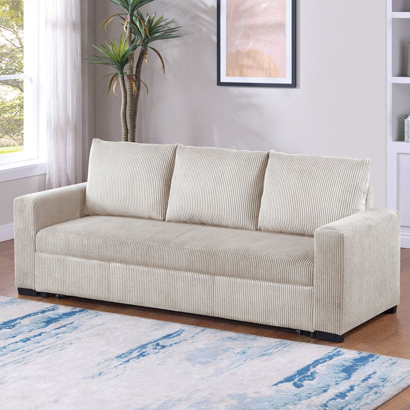 Ebern Designs Upholstered Convertible Sofa With Cushion Back In Ivory ... pertaining to Choosing the Perfect Corduroy Sofa Your Guide to Convertible Options